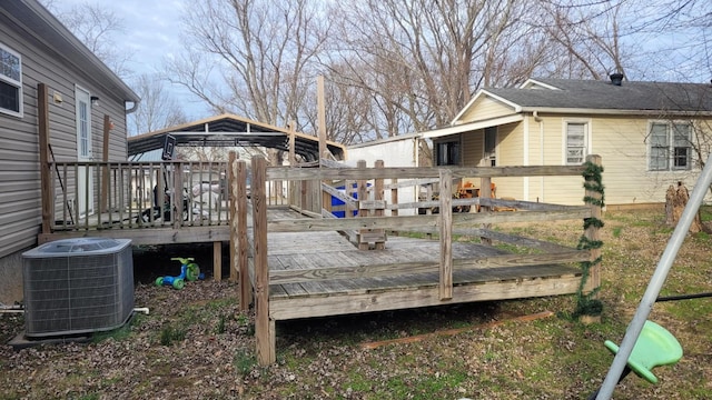 wooden deck featuring cooling unit