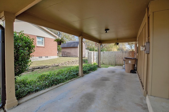 view of patio / terrace with a storage unit