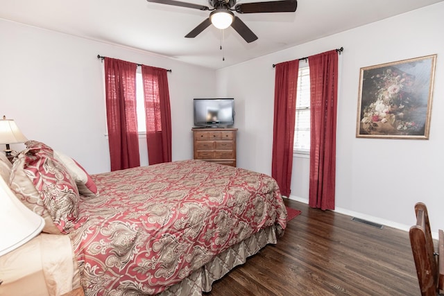 bedroom featuring dark hardwood / wood-style floors and ceiling fan