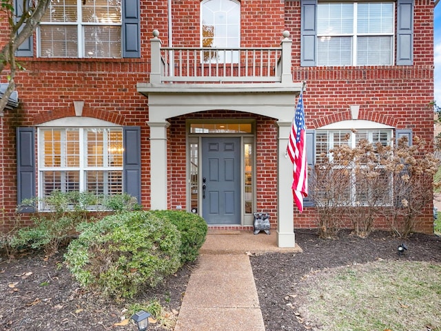 entrance to property with a balcony