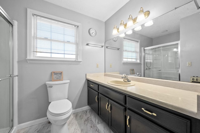 bathroom featuring walk in shower, vanity, and toilet