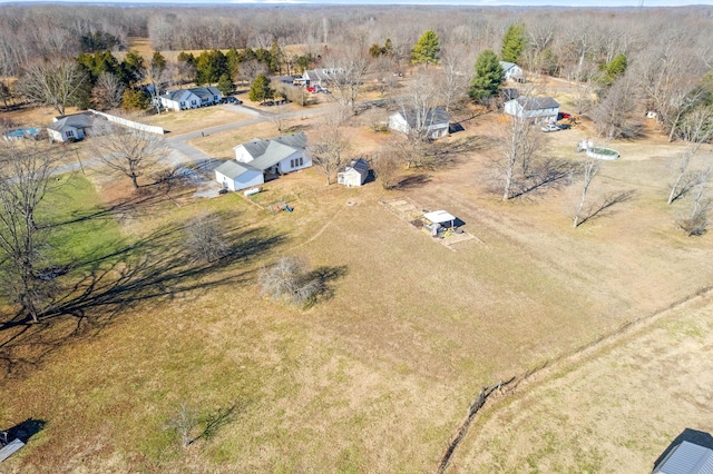 birds eye view of property with a rural view