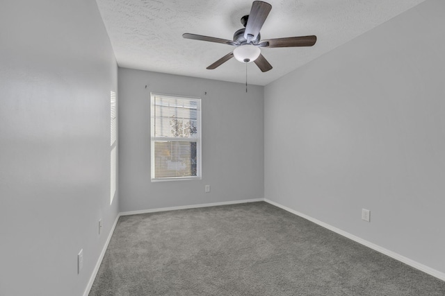 unfurnished room with ceiling fan, carpet flooring, and a textured ceiling