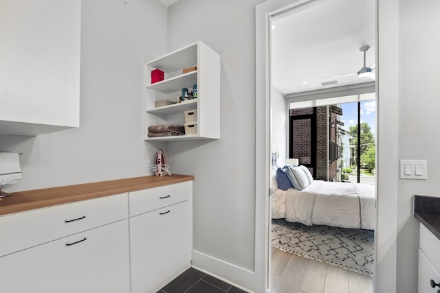 bedroom with dark hardwood / wood-style floors