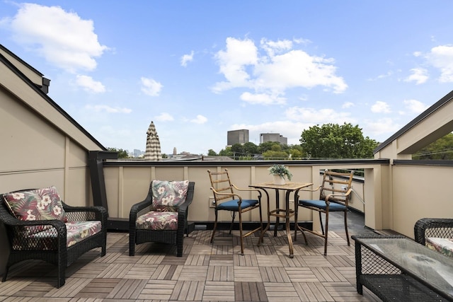 view of patio featuring a balcony