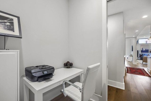 office with dark wood-type flooring