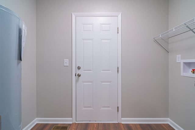 laundry room with hookup for a washing machine and dark wood-type flooring