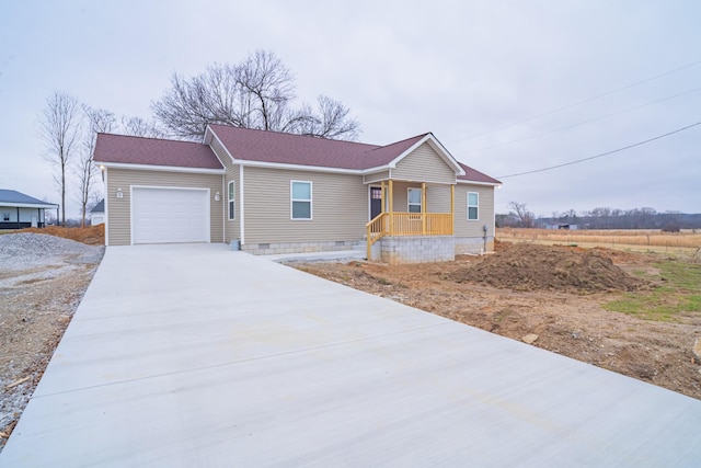 view of front of home with a garage and covered porch