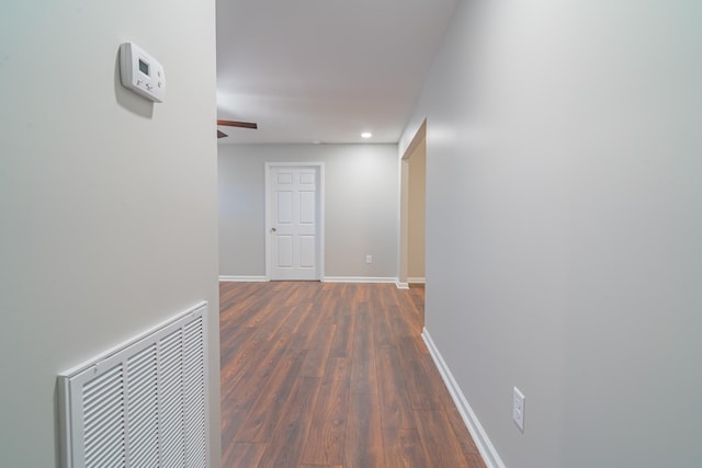 hallway featuring dark wood-type flooring