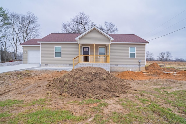 view of front facade featuring a garage and covered porch