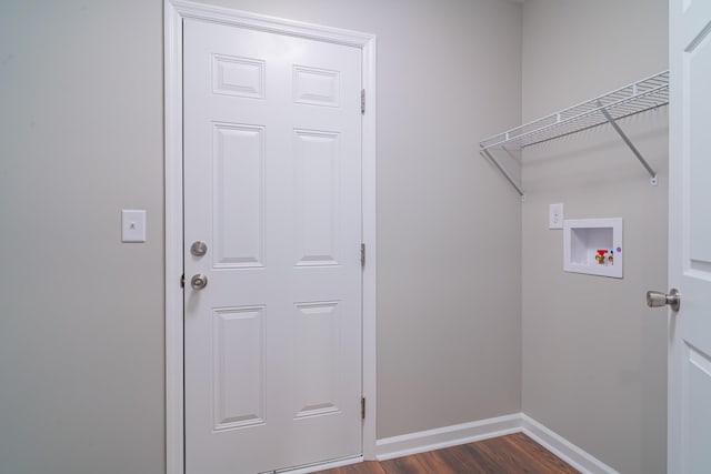 laundry area with washer hookup and dark hardwood / wood-style flooring