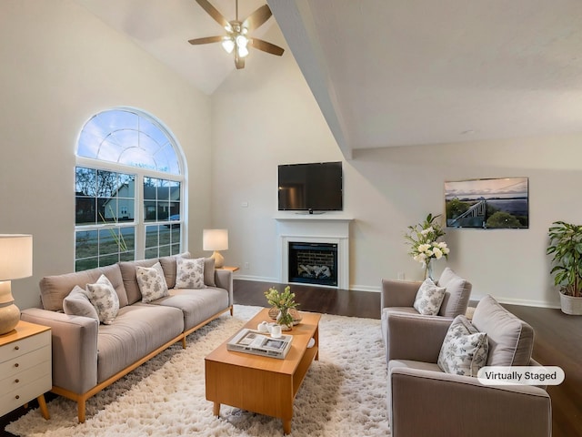 living room with wood-type flooring, high vaulted ceiling, and ceiling fan