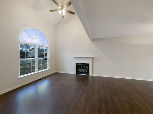 unfurnished living room with ceiling fan, high vaulted ceiling, and dark hardwood / wood-style flooring