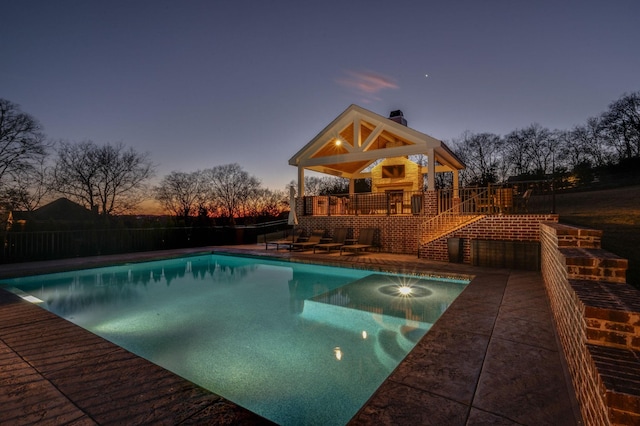 view of pool featuring a fenced in pool, a patio, stairway, fence, and a wooden deck