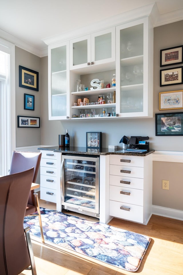 400 Warioto Way Unit 716, Ashland City, TN 37015 - bar area with wine cooler, crown molding, and light wood-type flooring