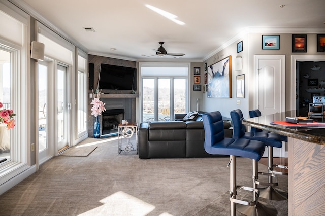 400 Warioto Way Unit 716, Ashland City, TN 37015 - living room with carpet flooring, ornamental molding, a large fireplace, and ceiling fan