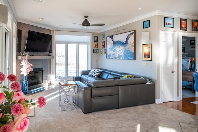 400 Warioto Way Unit 716, Ashland City, TN 37015 - living area featuring ceiling fan, crown molding, a fireplace, and wood finished floors