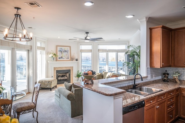 400 Warioto Way Unit 716, Ashland City, TN 37015 - kitchen with dishwasher, a sink, ornamental molding, open floor plan, and light stone counters