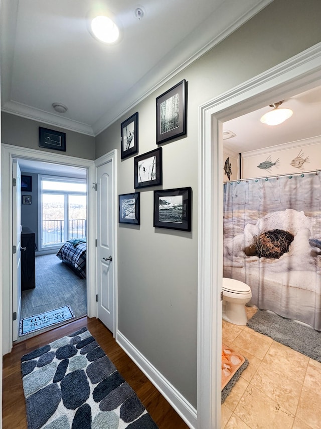 400 Warioto Way Unit 716, Ashland City, TN 37015 - hall with crown molding, baseboards, and wood finished floors
