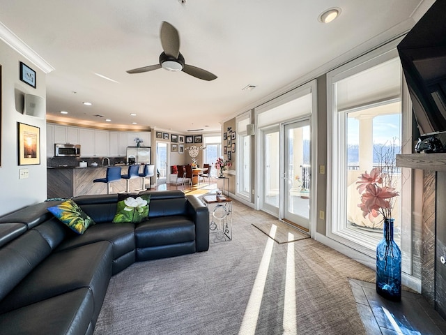 400 Warioto Way Unit 716, Ashland City, TN 37015 - living area featuring a ceiling fan, recessed lighting, crown molding, and light carpet