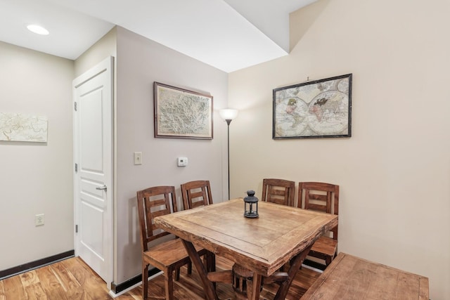 dining space featuring hardwood / wood-style flooring