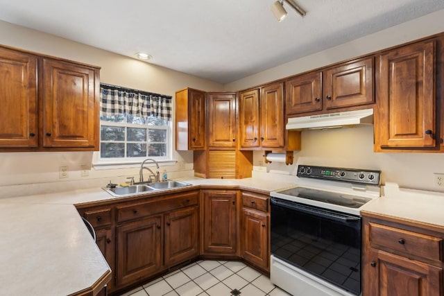 kitchen with sink and range with electric stovetop