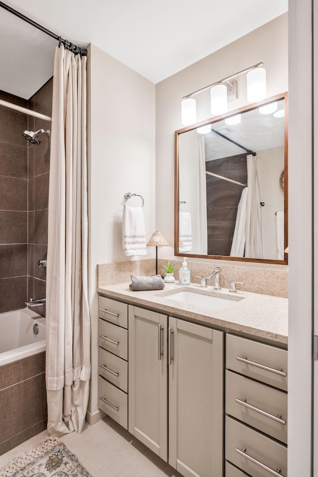 bathroom with shower / bath combination with curtain, vanity, and tile patterned flooring