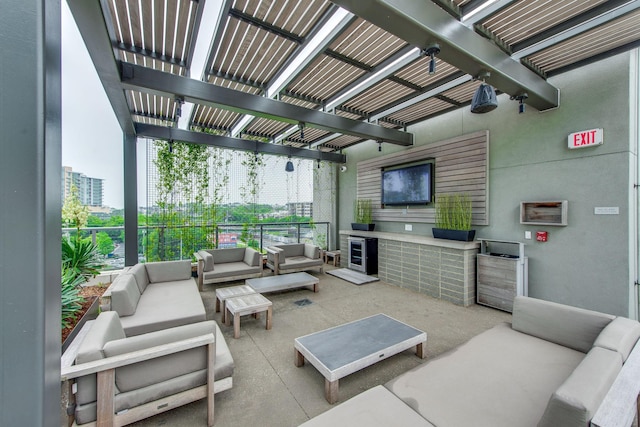 view of patio featuring an outdoor living space and a pergola