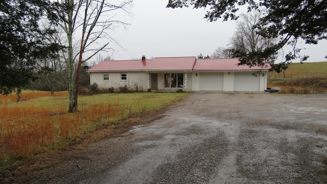 ranch-style home with a garage