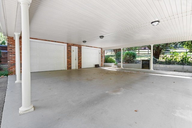 garage featuring a carport