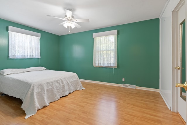 bedroom featuring ceiling fan and light hardwood / wood-style flooring