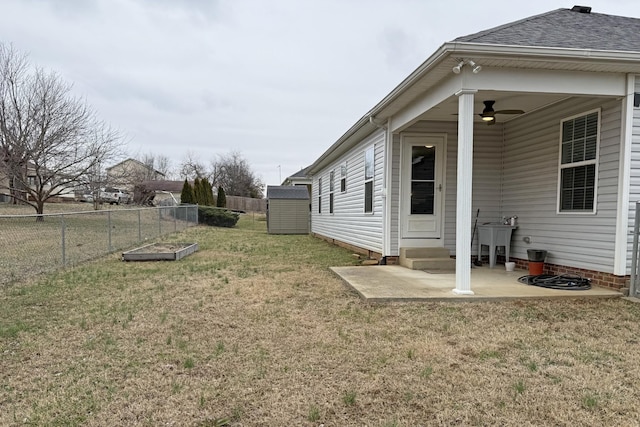 view of yard featuring ceiling fan, sink, and a patio area