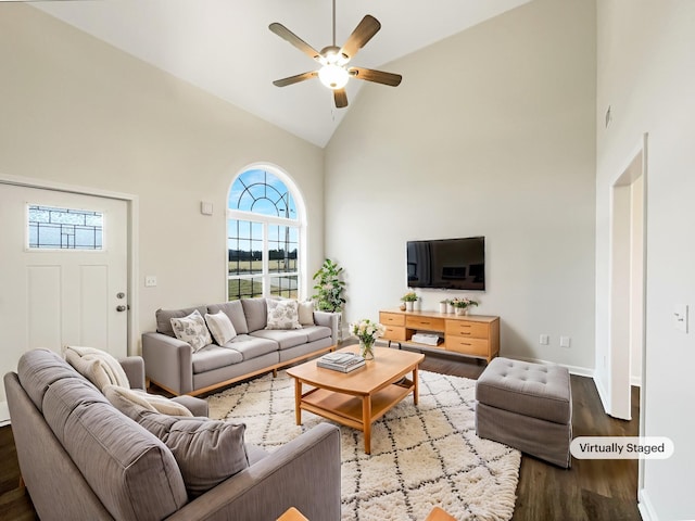 living room with ceiling fan, high vaulted ceiling, and light wood-type flooring