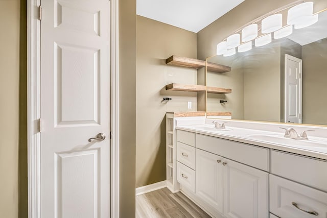 bathroom featuring vanity and hardwood / wood-style floors