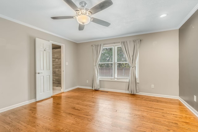 unfurnished room featuring ornamental molding, ceiling fan, and light hardwood / wood-style flooring