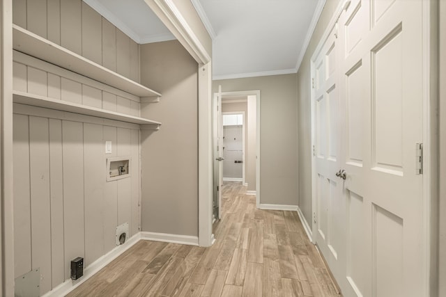 washroom featuring ornamental molding, washer hookup, and light hardwood / wood-style flooring