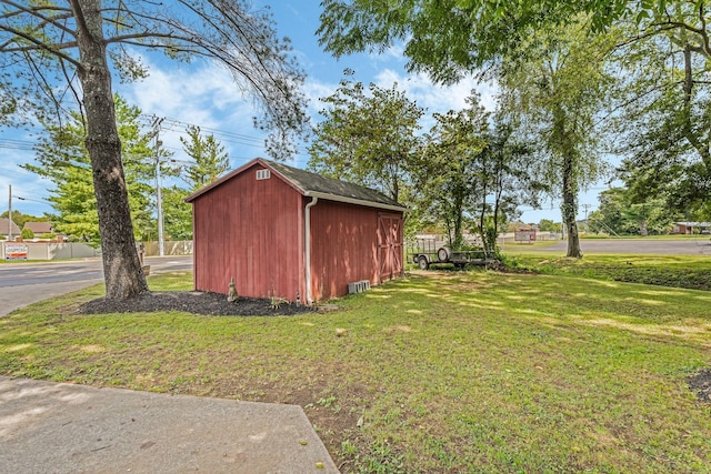 view of outdoor structure with a lawn