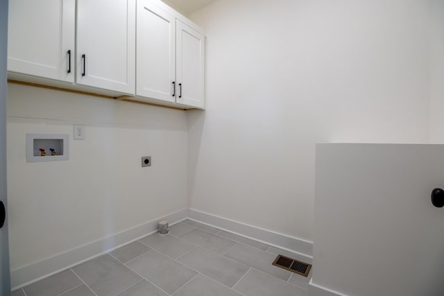 laundry room with visible vents, baseboards, washer hookup, cabinet space, and electric dryer hookup