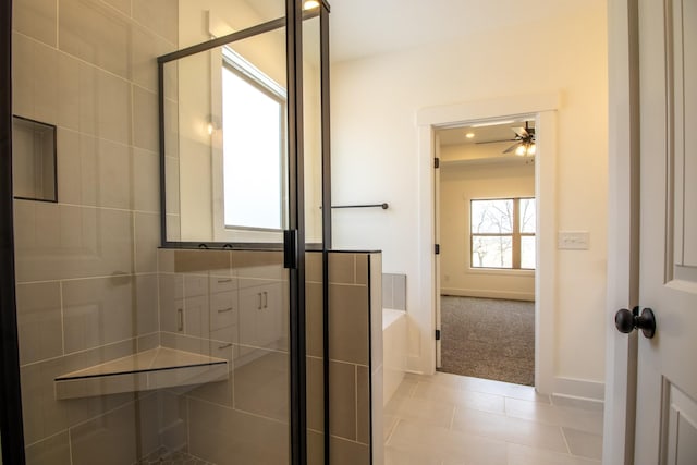 bathroom with a bath, tile patterned floors, a shower stall, and ceiling fan