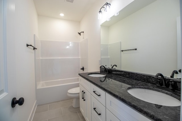 full bathroom featuring tile patterned flooring, bathing tub / shower combination, a sink, and toilet