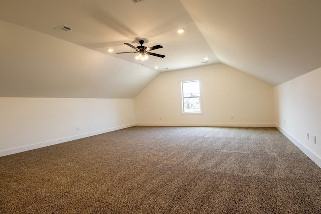 bonus room featuring carpet flooring, baseboards, visible vents, lofted ceiling, and ceiling fan
