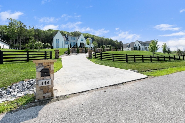 exterior space with a front yard and a rural view