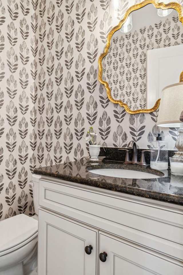 bathroom with vanity and toilet