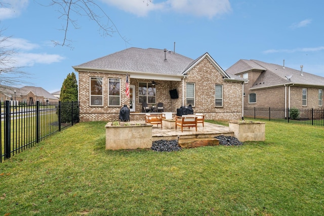 rear view of house featuring a patio, outdoor lounge area, and a lawn