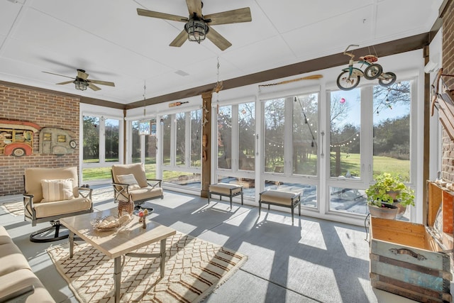 sunroom / solarium featuring ceiling fan and a wealth of natural light