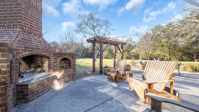 view of patio featuring an outdoor brick fireplace