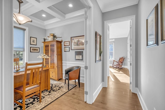 hall featuring coffered ceiling, ornamental molding, beamed ceiling, and light wood-type flooring