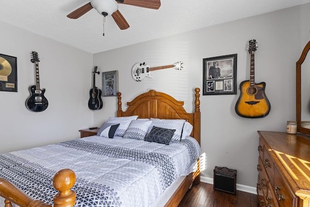 bedroom with dark wood-type flooring and ceiling fan