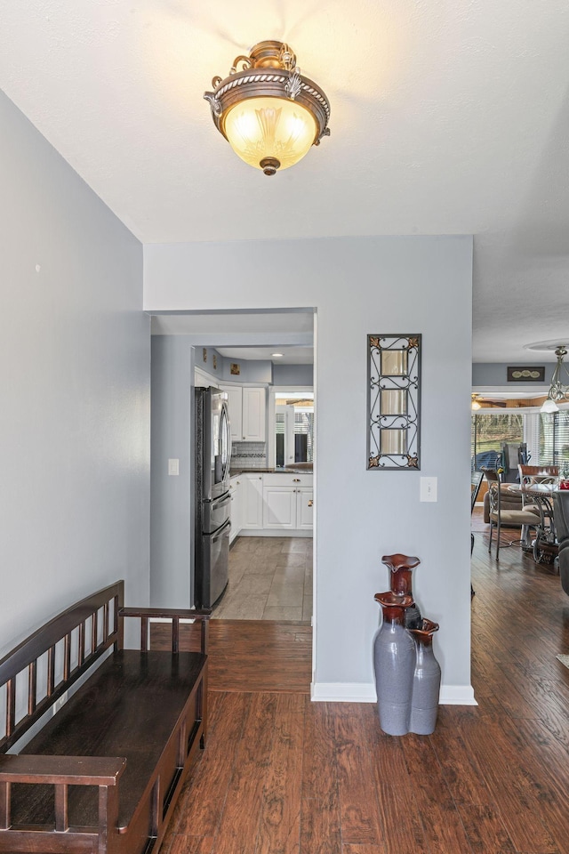 corridor with dark wood-type flooring