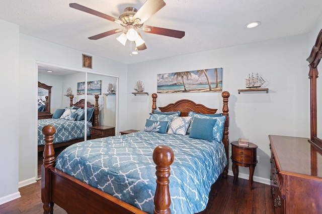 bedroom featuring a closet, dark hardwood / wood-style floors, and ceiling fan